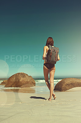 Buy stock photo Shot of a young backpacker admiring the beautiful scenery at the beach