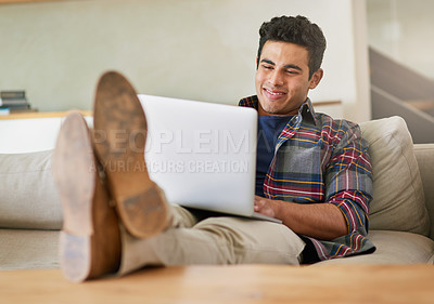 Buy stock photo Man, laptop and sofa for internet reading in home for streaming entertainment, subscription or movie. Male person, couch and relax weekend in apartment for watching film in house, media or networking