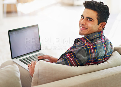 Buy stock photo Man, portrait and laptop on sofa for online connection or entertainment subscription, writing or networking. Male person, face and smile on couch in living room or typing email, internet or home