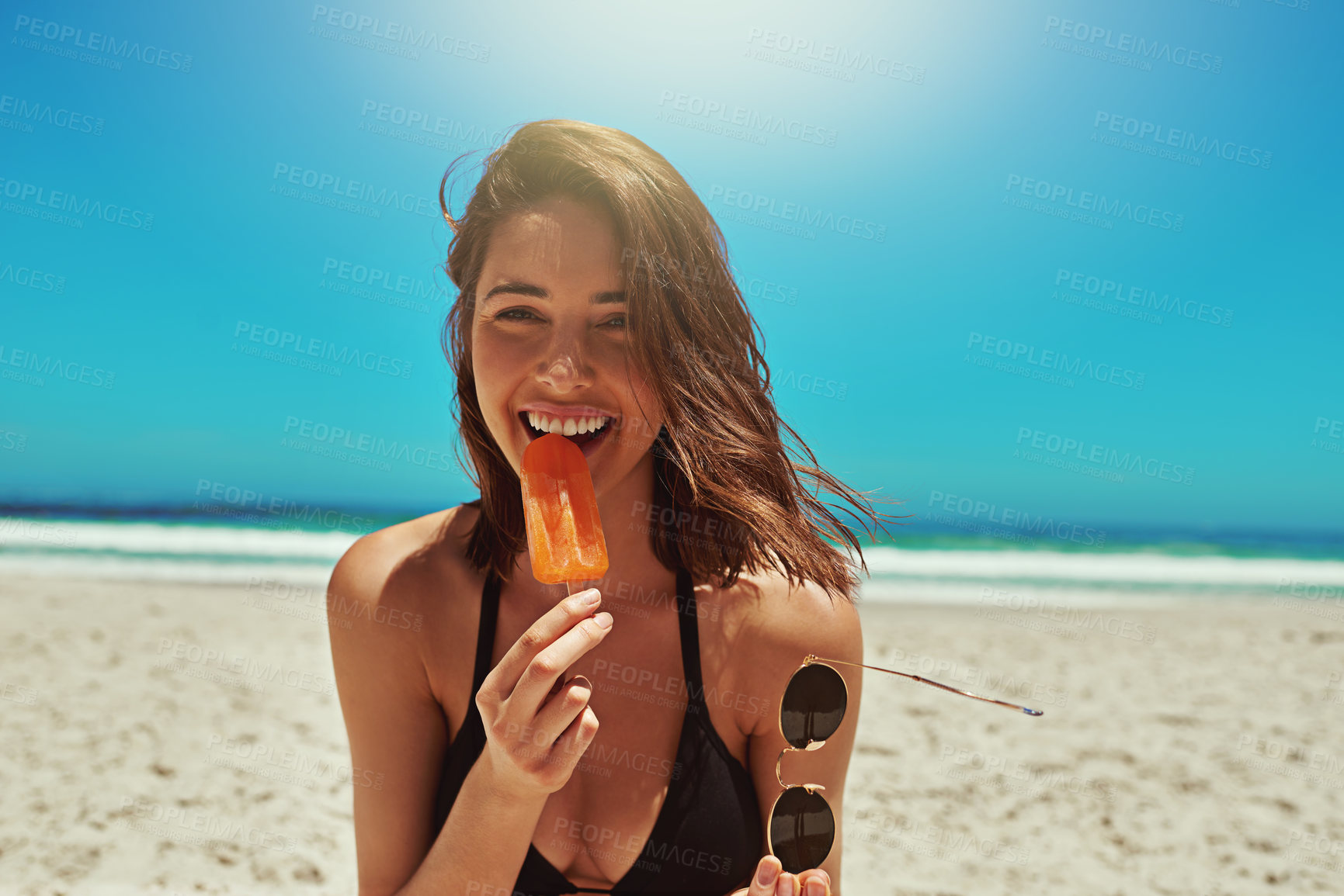 Buy stock photo Ice cream, beach and woman portrait on holiday by the sea and blue sky with happiness. Sun, sand and young female person face with a happy smile and lens flare by the ocean in summer on vacation