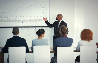Buy stock photo Presentation, black man in a business meeting and training in an office of their workplace. Leader or strategy, collaboration or teamwork and people in a workshop for statistics or planning.