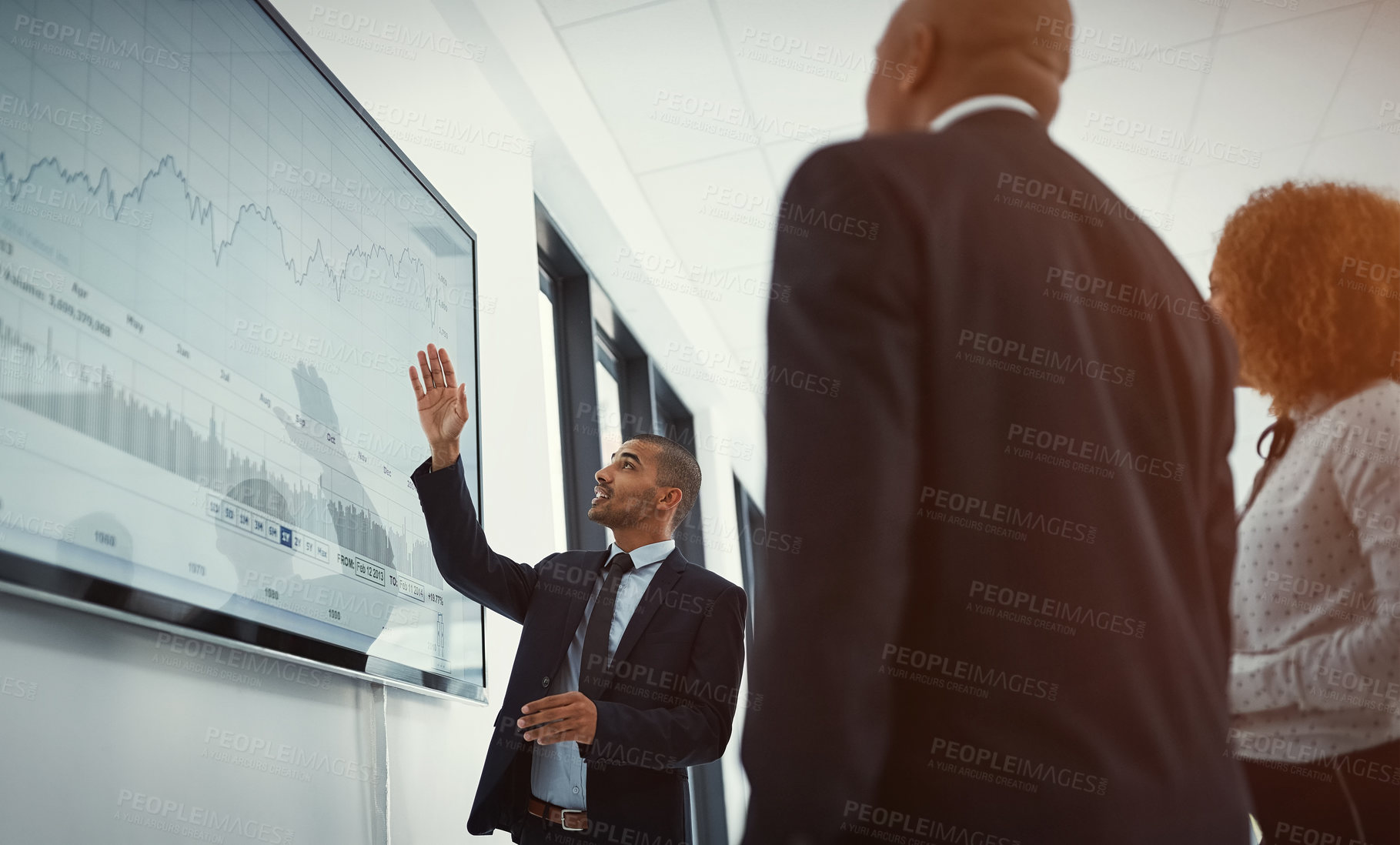 Buy stock photo Shot of a young businessman giving a presentation in the boardroom