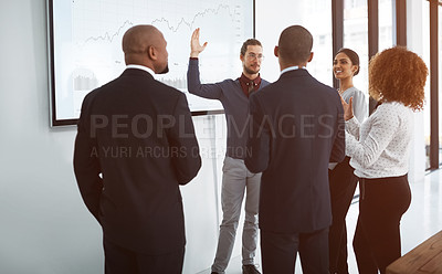 Buy stock photo Shot of a young businessman giving a presentation in the boardroom