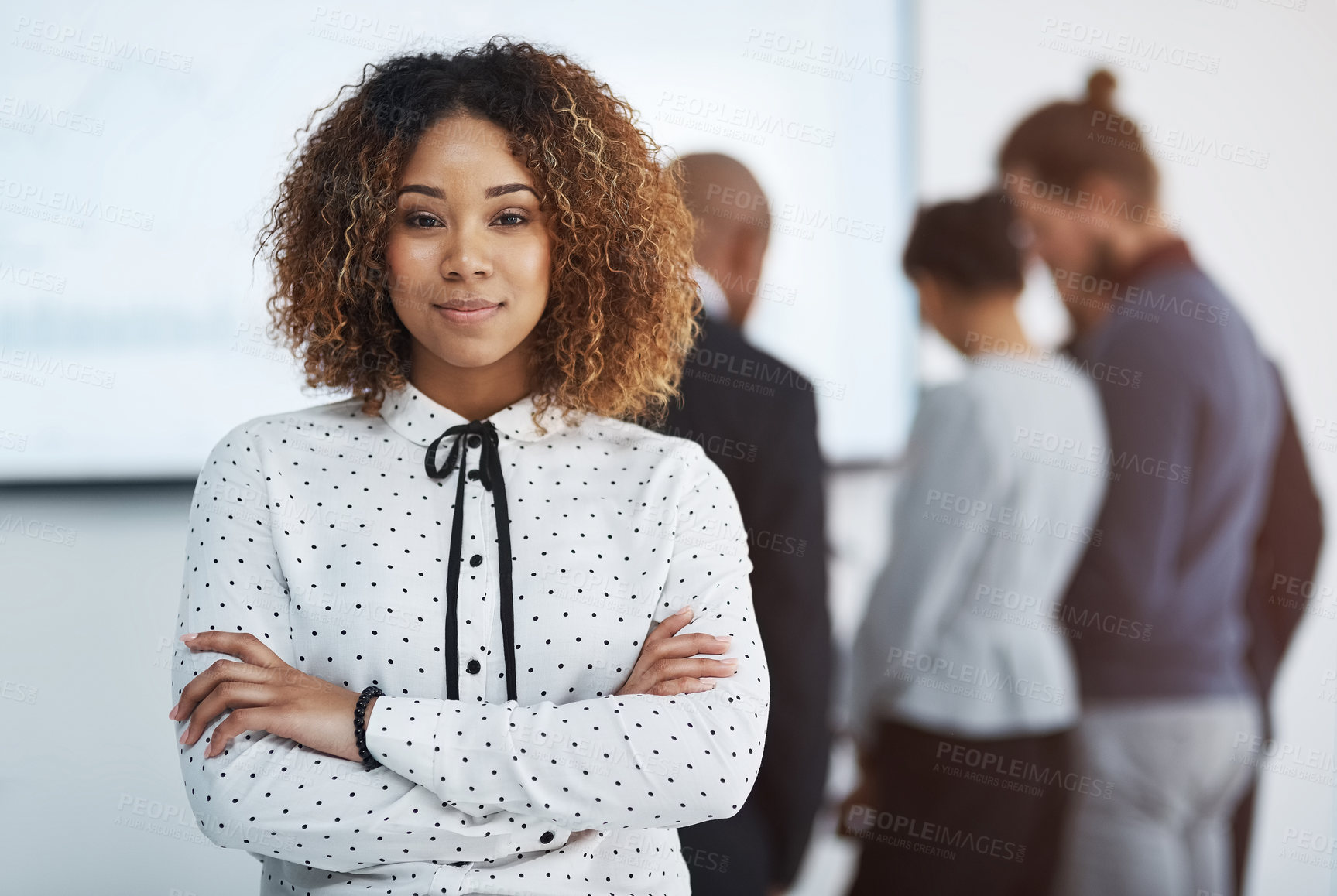 Buy stock photo Arms crossed, company and portrait of business woman in boardroom of office with colleagues for meeting. Confident, creative and mission with design employee in workplace for upskill training