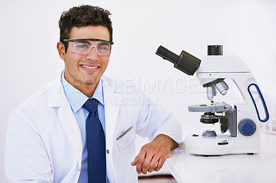 Buy stock photo Scientist, man and microscope in portrait with smile, safety goggles and studying in laboratory for bacteria evolution. Person, technician and happy with tools for zoom, analysis and DNA research