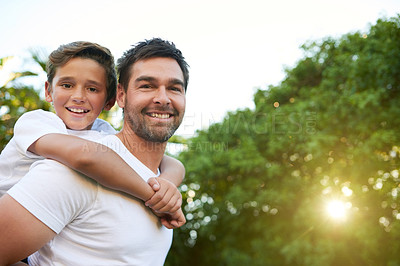 Buy stock photo Cropped shot of an affectionate young father and his son