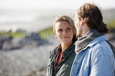 Buy stock photo Happy, love and couple by ocean in winter for bonding, loving relationship and relax outdoors. Nature, travel and man and woman by seaside for holiday, vacation and weekend together for romance