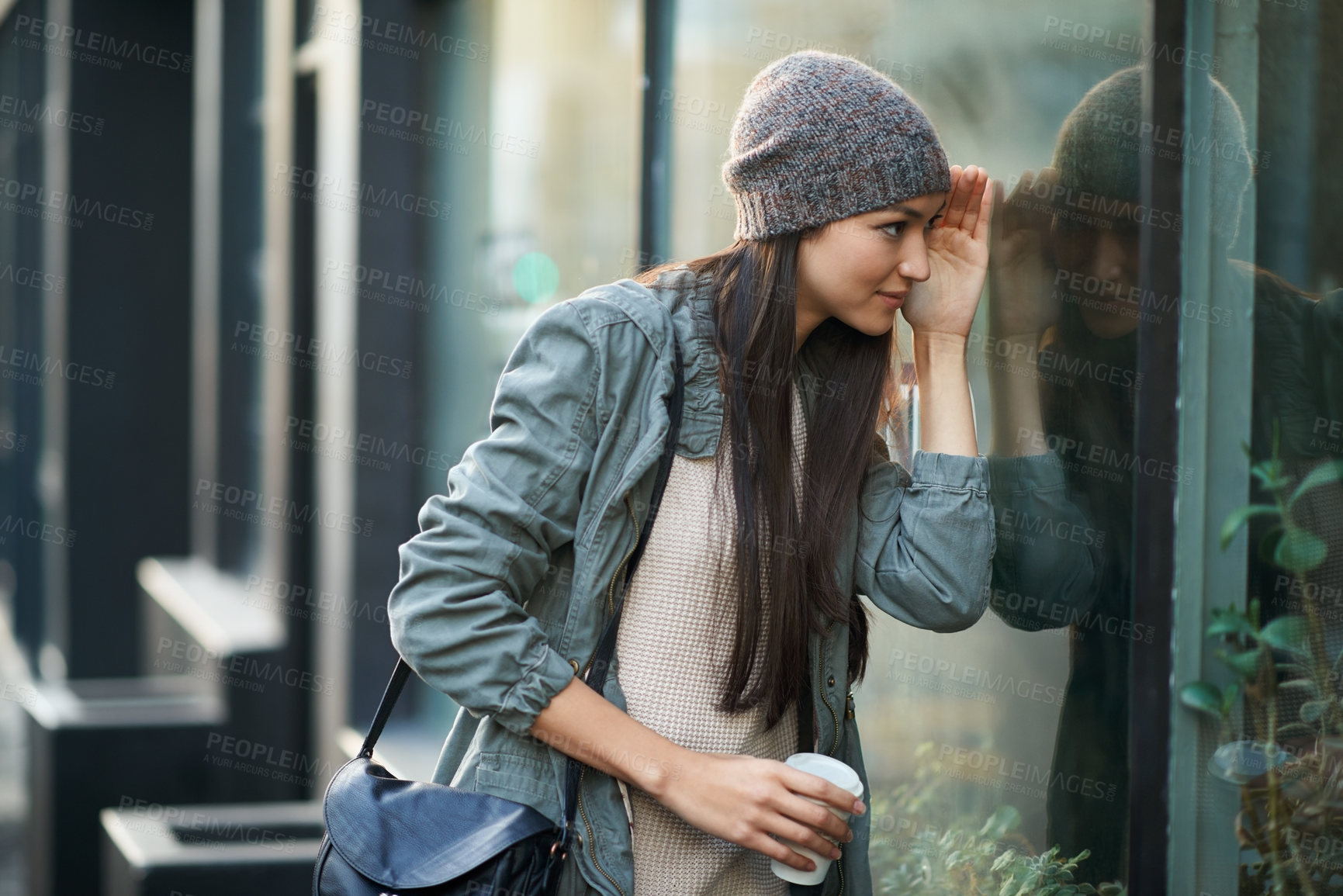 Buy stock photo Shot of an attractive young woman out in the city