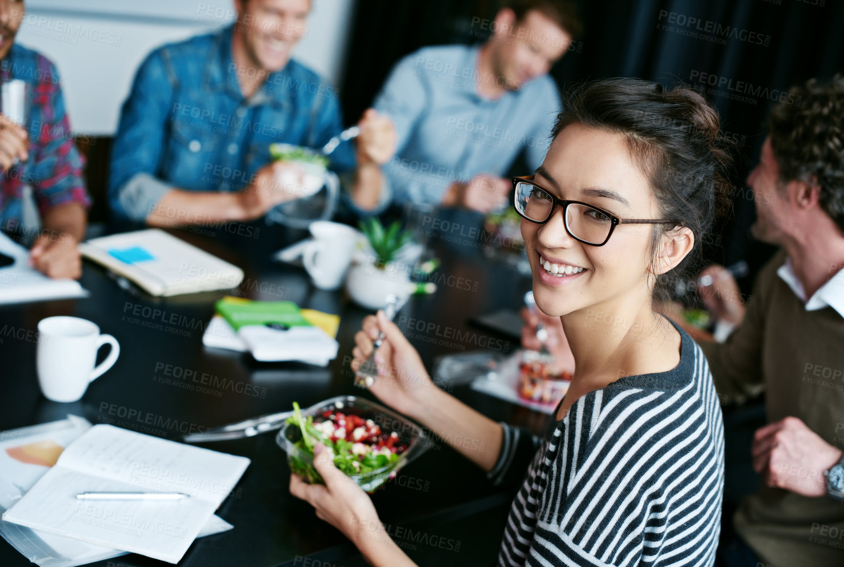 Buy stock photo Meeting, smile and portrait of woman with salad in office for team building lunch for collaboration. Creative, happy and Asian female designer with colleagues eating healthy meal in workplace.