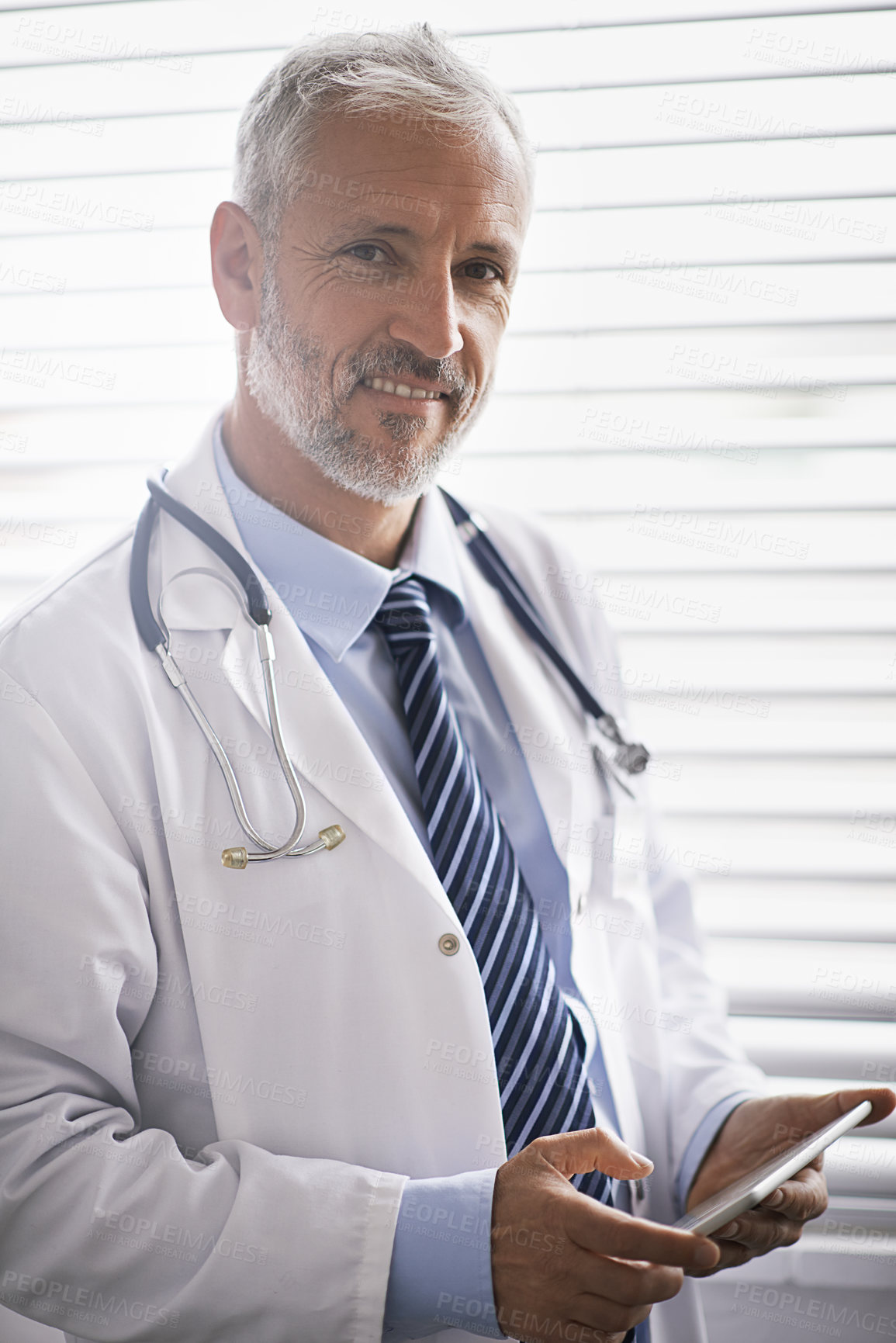 Buy stock photo Hospital, clinic and portrait of doctor on tablet for medical results, research and online consulting. Office, healthcare and mature man on digital tech for website, telehealth service and wellness