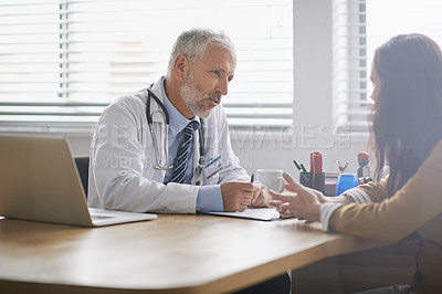 Buy stock photo Shot of a doctor meeting with his patient
