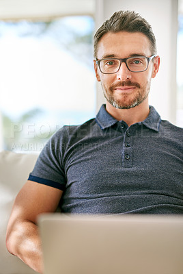 Buy stock photo Smile, computer and portrait of man on sofa working on freelance creative project at apartment. Happy, glasses and mature male writer with laptop for research online with blog in living room at home.