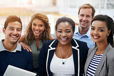 Buy stock photo Portrait of a group of smiling coworkers standing in an office