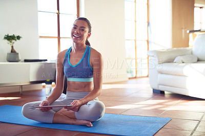 Buy stock photo Portrait of a young woman using a digital tablet while exercising at home