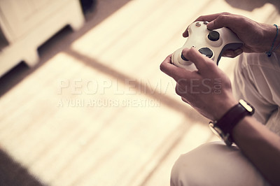 Buy stock photo Cropped shot of an unrecognizable man playing video games