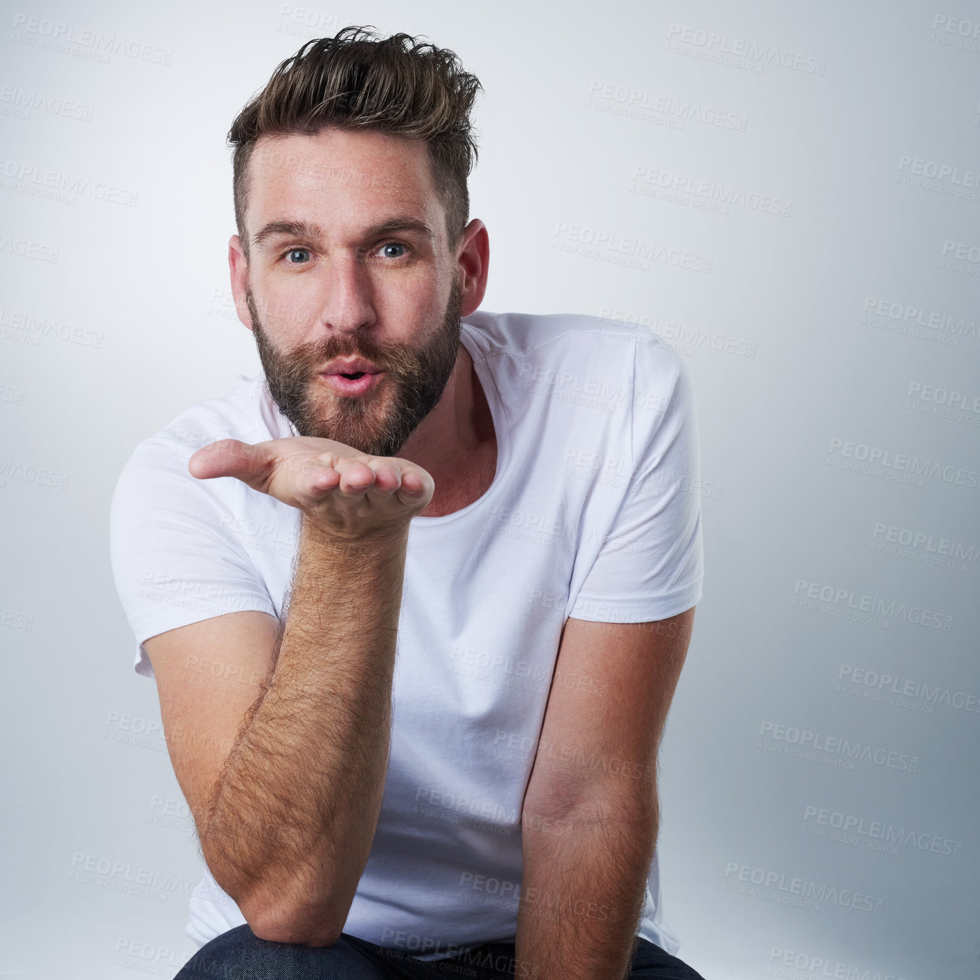 Buy stock photo Romantic, blowing kiss and portrait of man in studio for flirting, affection or love expression. Valentines day, anniversary and face of male model and gesture on white background for passion or date