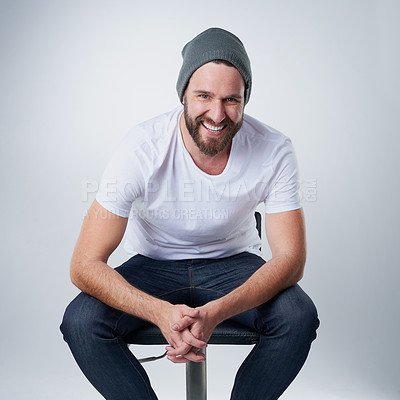 Buy stock photo Portrait of a happy young man posing against a white background in studio