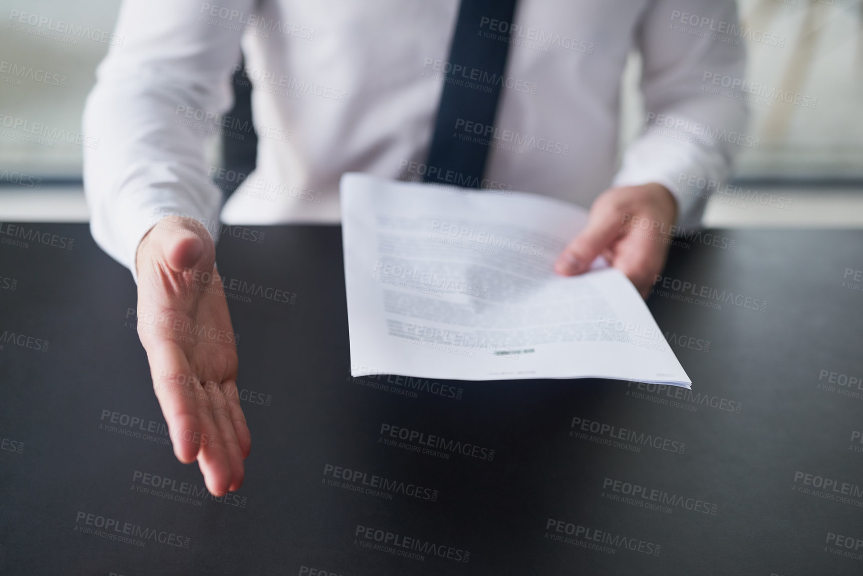 Buy stock photo Cropped shot of a businessman holding a resume and extending  his arm to shake hands