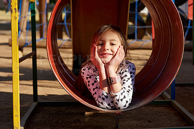Buy stock photo Portrait of a little girl playing in a park