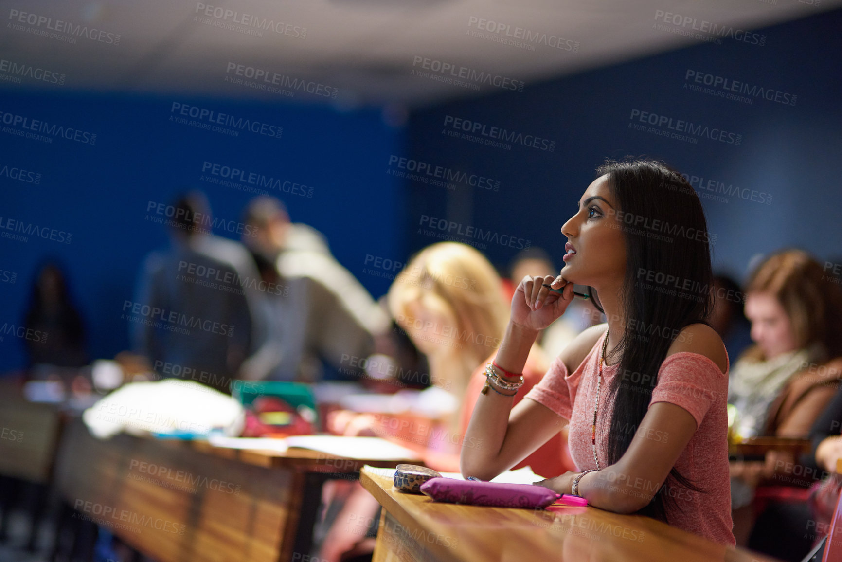 Buy stock photo Woman, university and student with thinking in lecture hall for lesson, teaching and learning on campus. Female person, college and ideas with studying or revision for exam, test and assignment