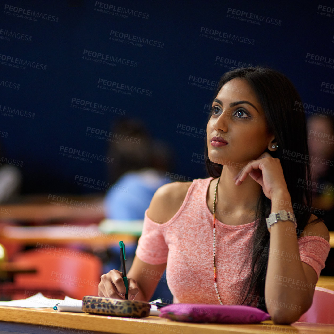 Buy stock photo Woman, college and student with thinking in lecture hall for lesson, teaching and learning on campus. Female person, university and writing notes for study or revision for exam, test and assignment