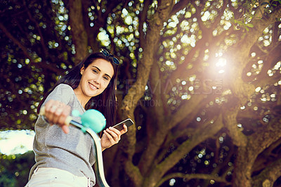 Buy stock photo Bike, cycling and woman with portrait, outdoor and activity with smile and cellphone. Girl, happiness and alternative transport with carbon neutral travel, eco friendly and smartphone on bicycle