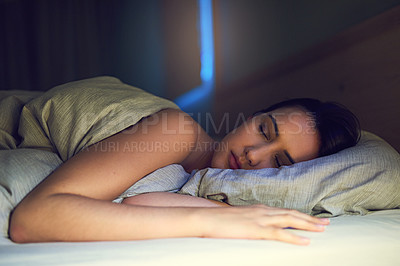 Buy stock photo Shot of a young woman sound asleep in her bedroom