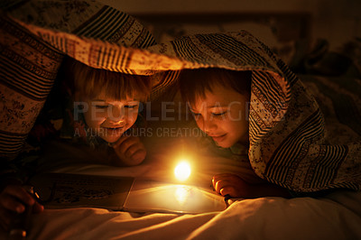 Buy stock photo Blanket, flashlight and children at night with happiness reading a book with fantasy and magic. Friends, relax and storytelling in dark with light under duvet at sleepover with a pillow tent