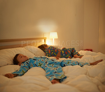 Buy stock photo Brothers, sleep and night in bed for rest together, peace and health in family home. Young tired kids, boy children and tired with calm sleeping, fatigue and dream on blanket in bedroom at house