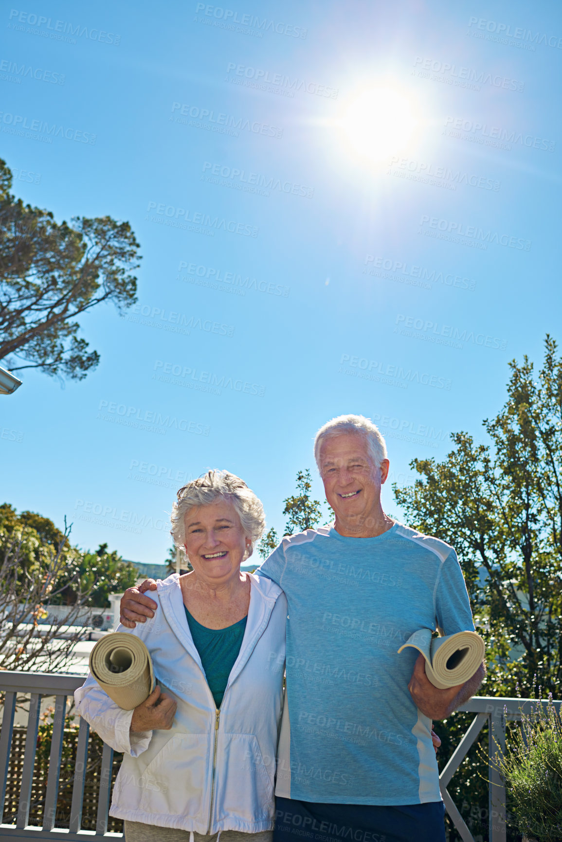 Buy stock photo Portrait of a senior couple standing outside ready to do yoga together