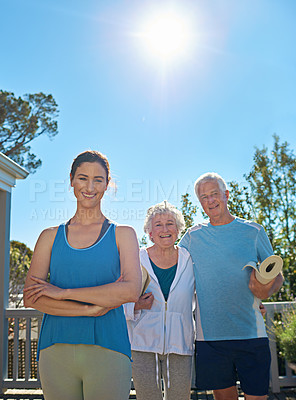 Buy stock photo Portrait of a senior couple standing outside ready to do yoga with an instructor
