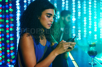 Buy stock photo Club, woman and smartphone with typing, night and social media with party, connection and internet. Person, bar and girl with cellphone, neon lights or website information with digital app or network