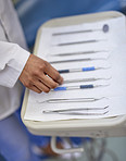 Lining up dental tools on a tray