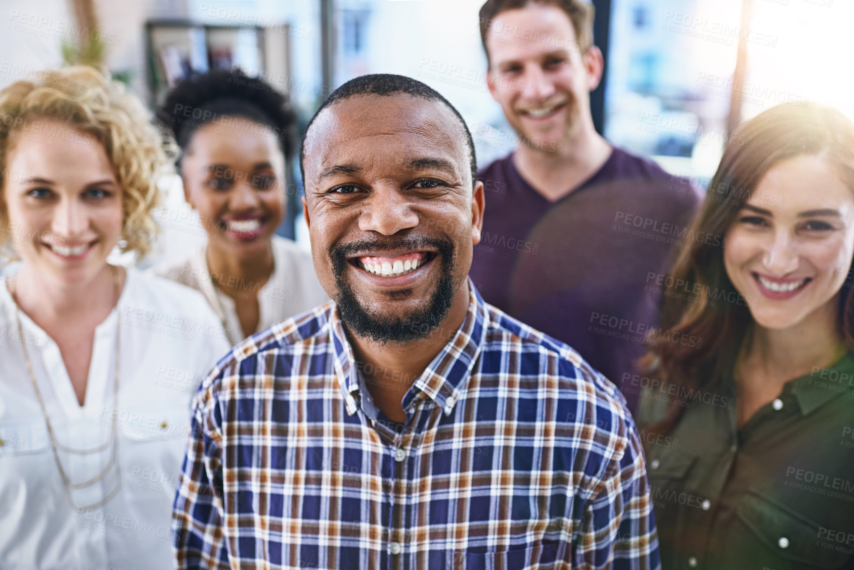 Buy stock photo Happy black man, portrait and office with creative team in business startup, growth or diversity. African male person or employee in leadership for multicultural group, unity or about us at workplace