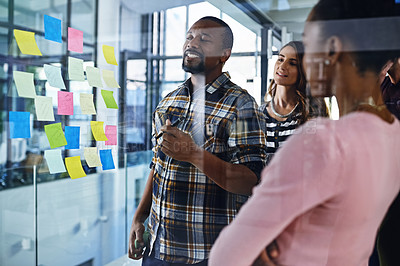 Buy stock photo Glass, planning and business people in office for training, collaboration and writing goal objectives. Teamwork, schedule and manager with group and storyboard notes on growth, target or coaching