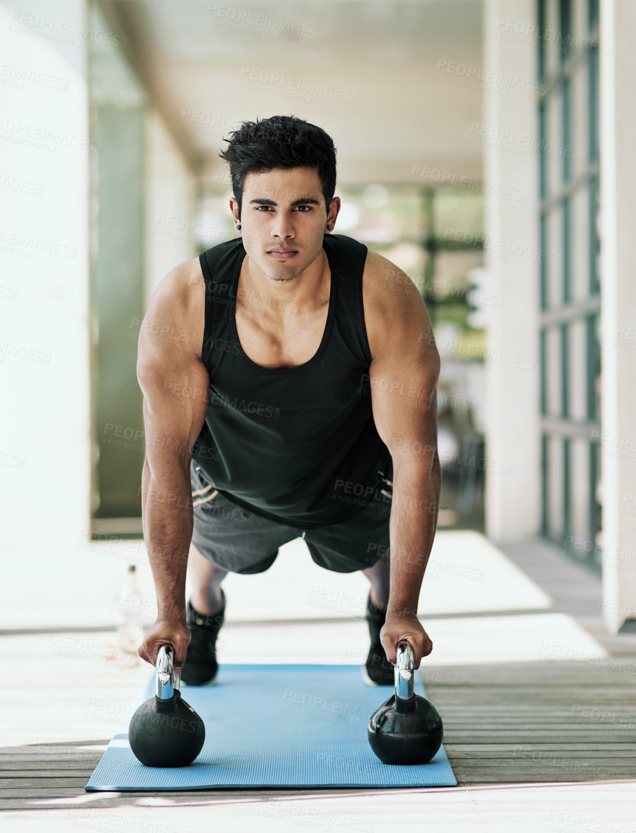 Buy stock photo Portrait, man and dumbbell in pushup on yoga mat for wellness, health or exercise in fitness, sport or cardio. Male person, athlete and home gym for training, muscle or endurance for abs or challenge