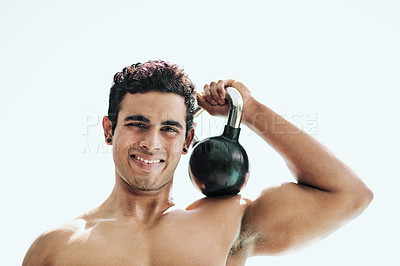 Buy stock photo Portrait of a shirtless young man posing with a kettle bell outside