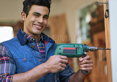 Buy stock photo Man, Carpenter and drill in portrait with smile in workshop, renovation or maintenance services. Male contractor, power tool and happiness for job in construction, home project or repair work