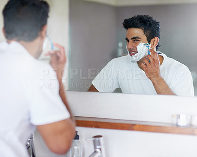 Buy stock photo Foam, mirror and man with razor in bathroom for hygiene, grooming and washing face at home, house and apartment. Male person, gen z guy and reflection of student with shaving cream, face or skin care