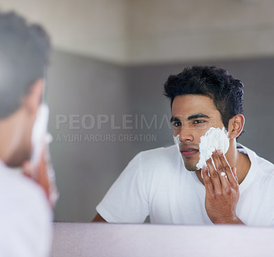 Buy stock photo Foam, mirror and reflection of man in bathroom for hygiene, grooming and washing face at home, house and apartment. Male person, gen z guy and shaving cream on student with soap, hands and skin care