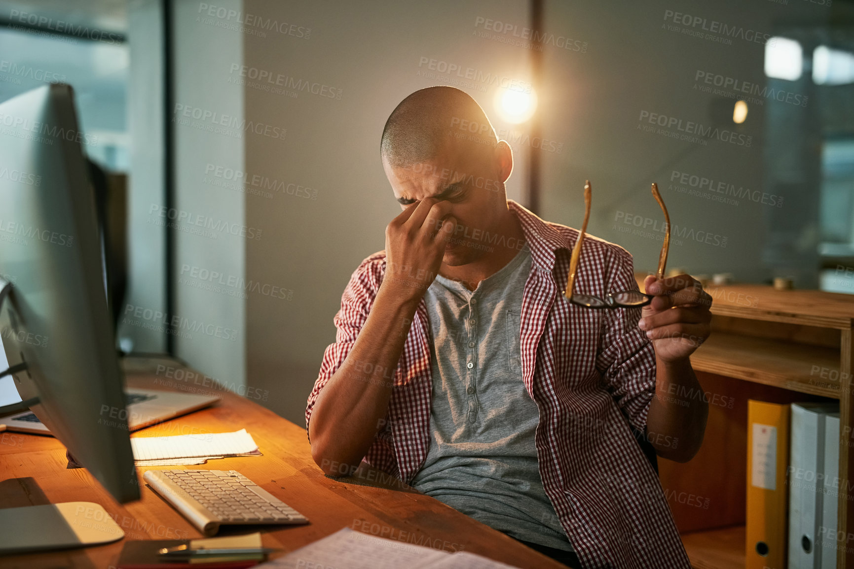 Buy stock photo Computer, stress and man with headache in office for pressure, fatigue and deadline of article. Journalist, editor and person and pain at creative agency for digital report, brain fog and burnout