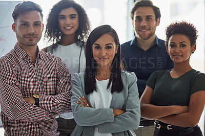 Buy stock photo Portrait of a group of confident businesspeople standing together in the office