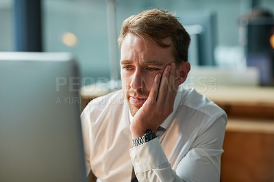 Buy stock photo Business, thinking and man on computer for decision, solution or problem solving in his office at night. Tired, bored or serious worker or accountant with stress, reading a report online or job news