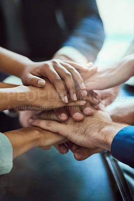Buy stock photo Closeup shot of a group of executives standing with their hands together in a huddle