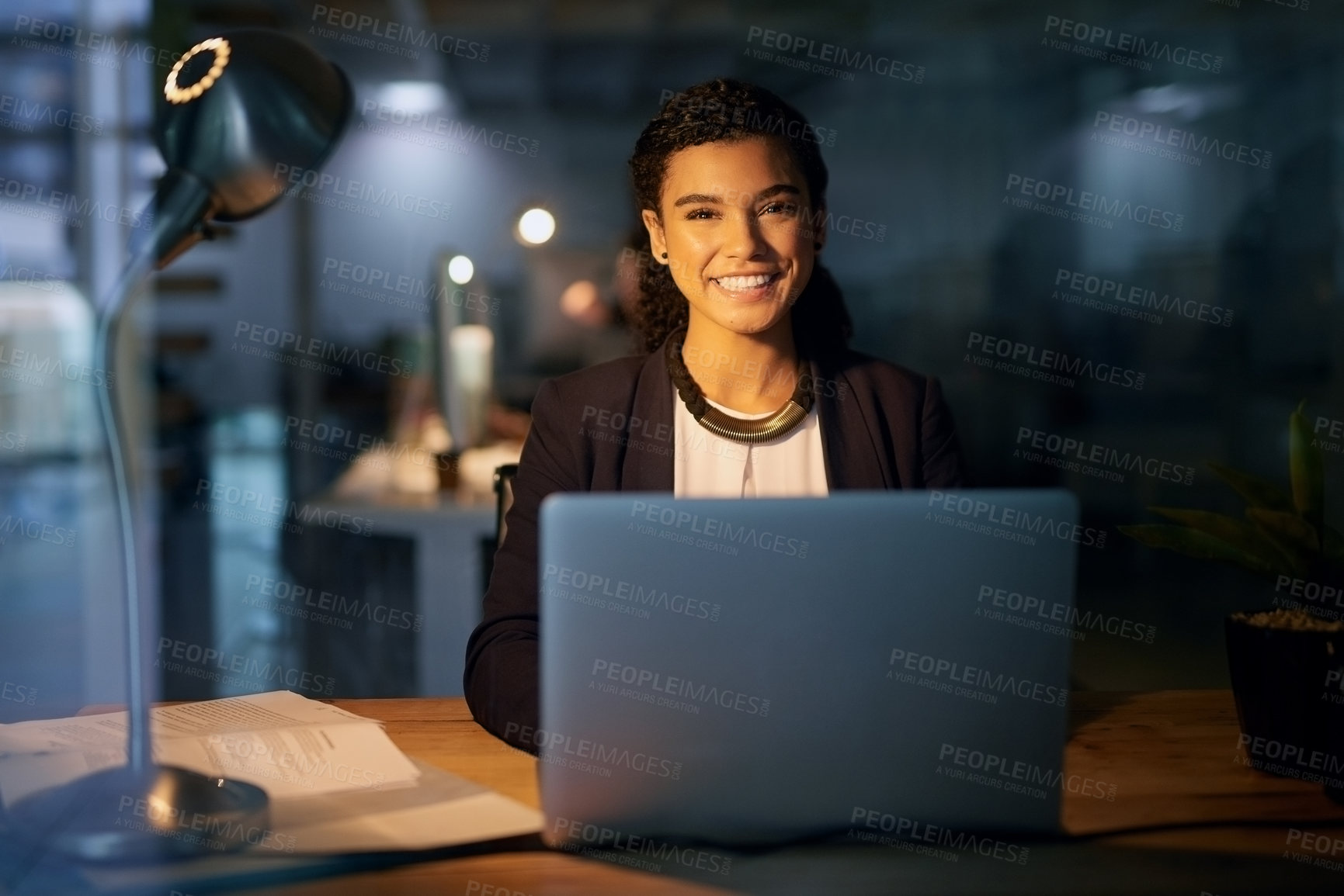 Buy stock photo Business woman, portrait and night with laptop at desk for project deadline, review or update records. Late, smile and employee with paperwork for overtime, happiness or data entry clerk in office