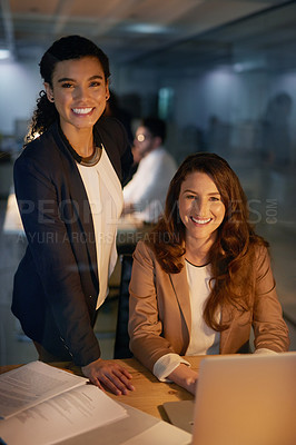 Buy stock photo Portrait of two businesswomen working overtime together in the office