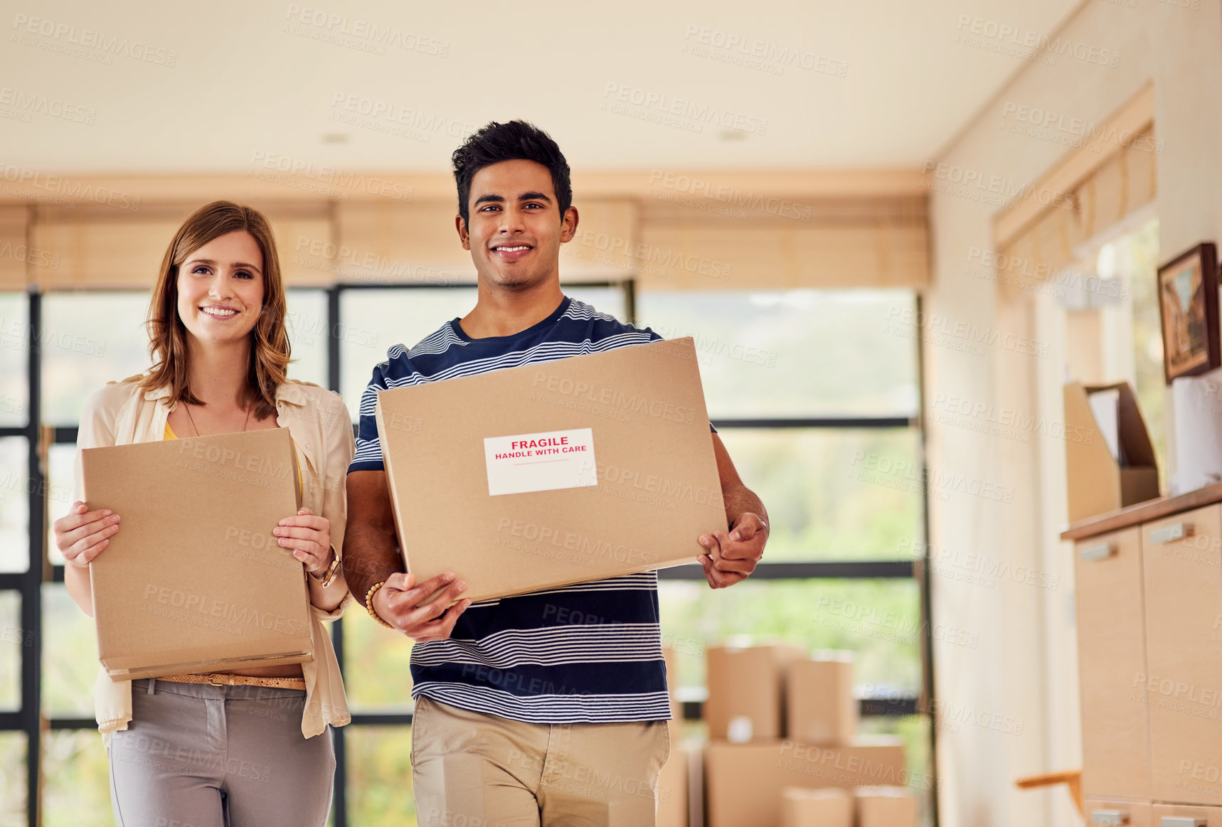 Buy stock photo Boxes, new house and couple with carrying in living room to celebrate a goal together. Happy man, woman and real estate or dream home portrait of property investment for smile and homeowner moving in