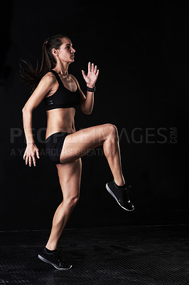 Buy stock photo Fitness, gym and woman athlete in studio running for competition, race or marathon training. Sports, workout and female runner with cardio exercise for health or wellness by dark black background.