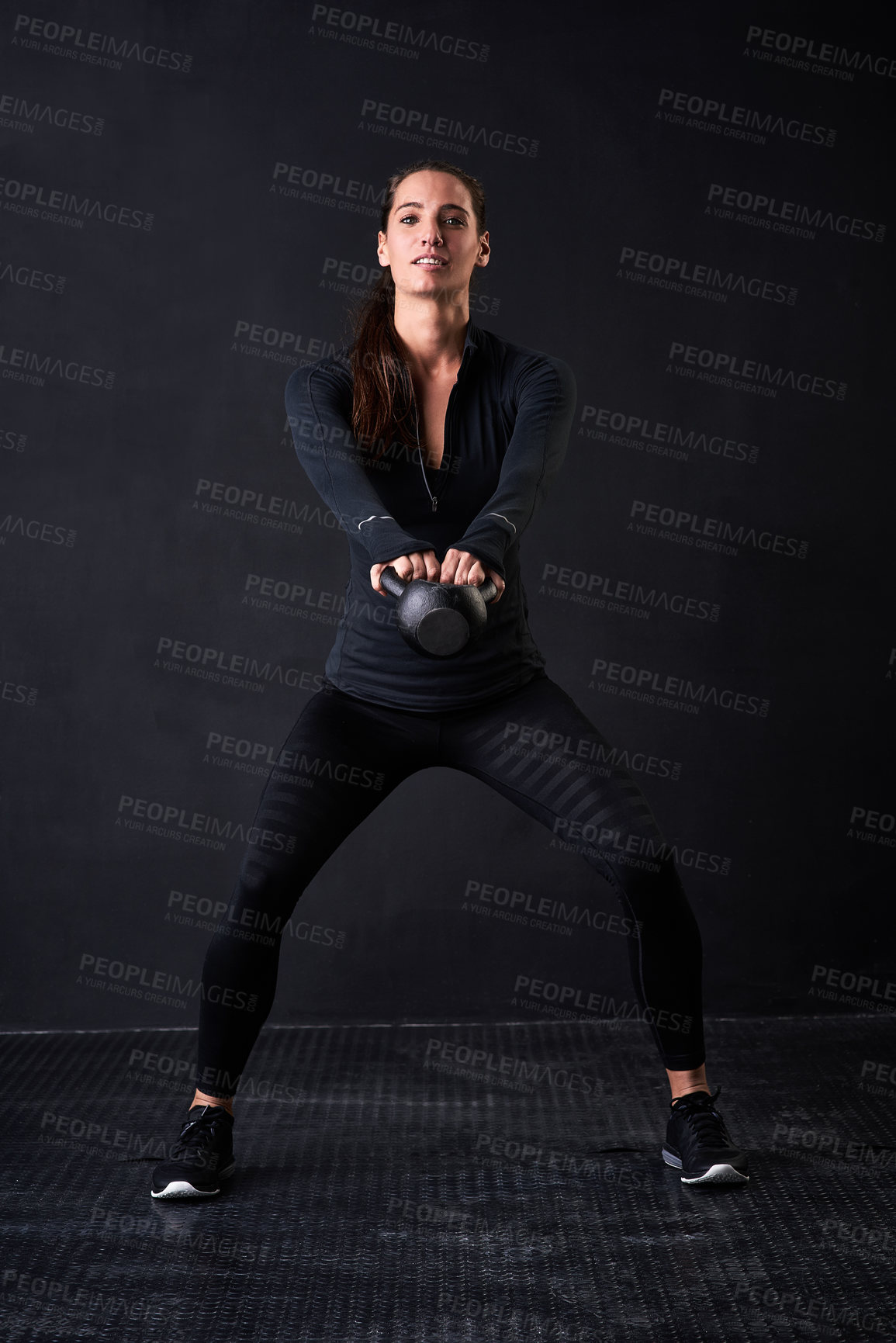 Buy stock photo Woman, portrait and exercise in studio with kettlebell for fitness or workout on black background. Face, power and training as strong athlete with body goals or weight lifting for sports or wellness