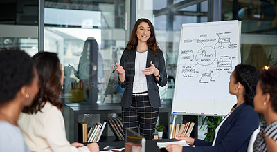 Buy stock photo Shot of an attractive young businesswoman giving a presentation in the boardroom
